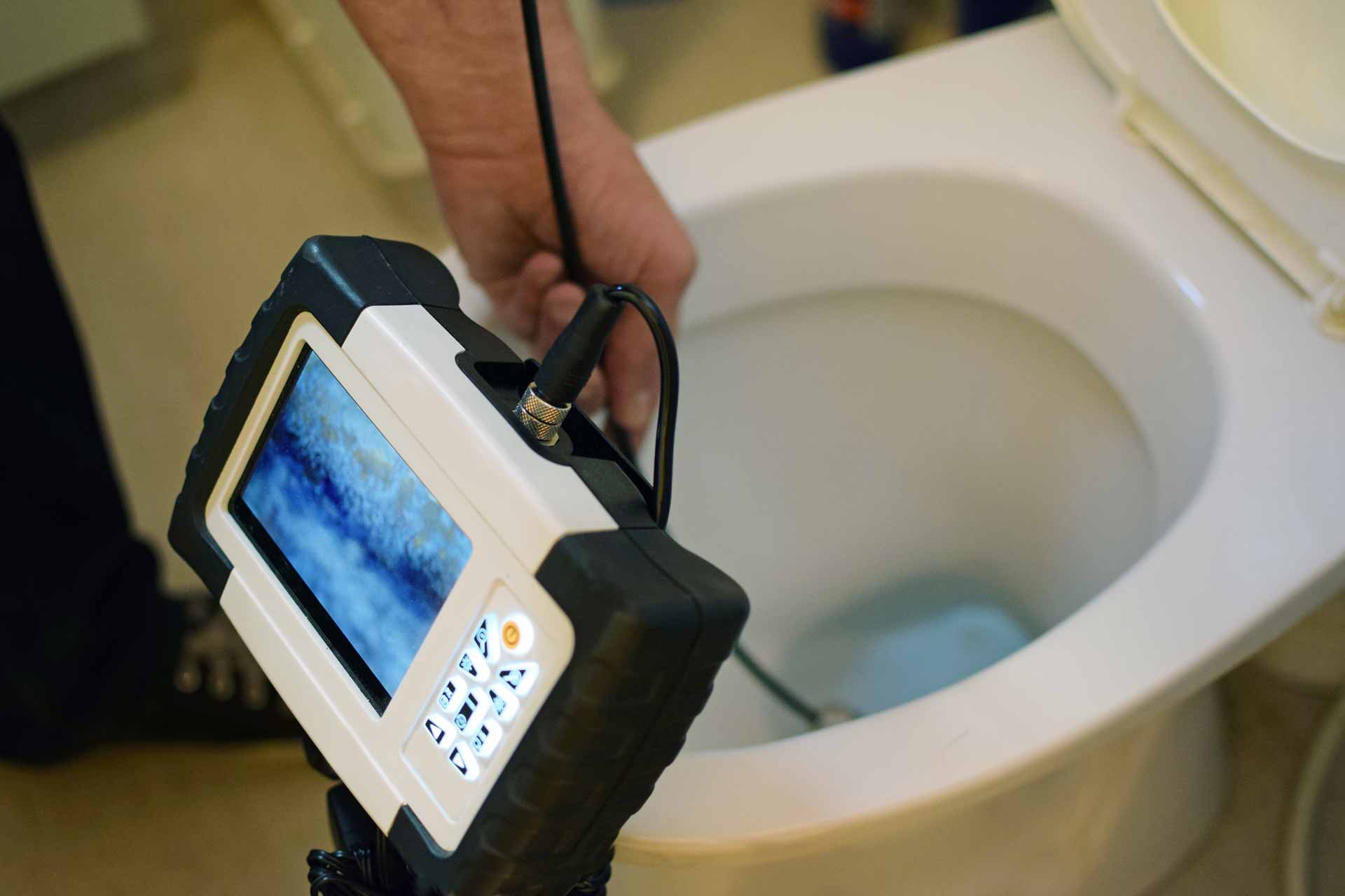 Inspecting a toilet drain with a video camera